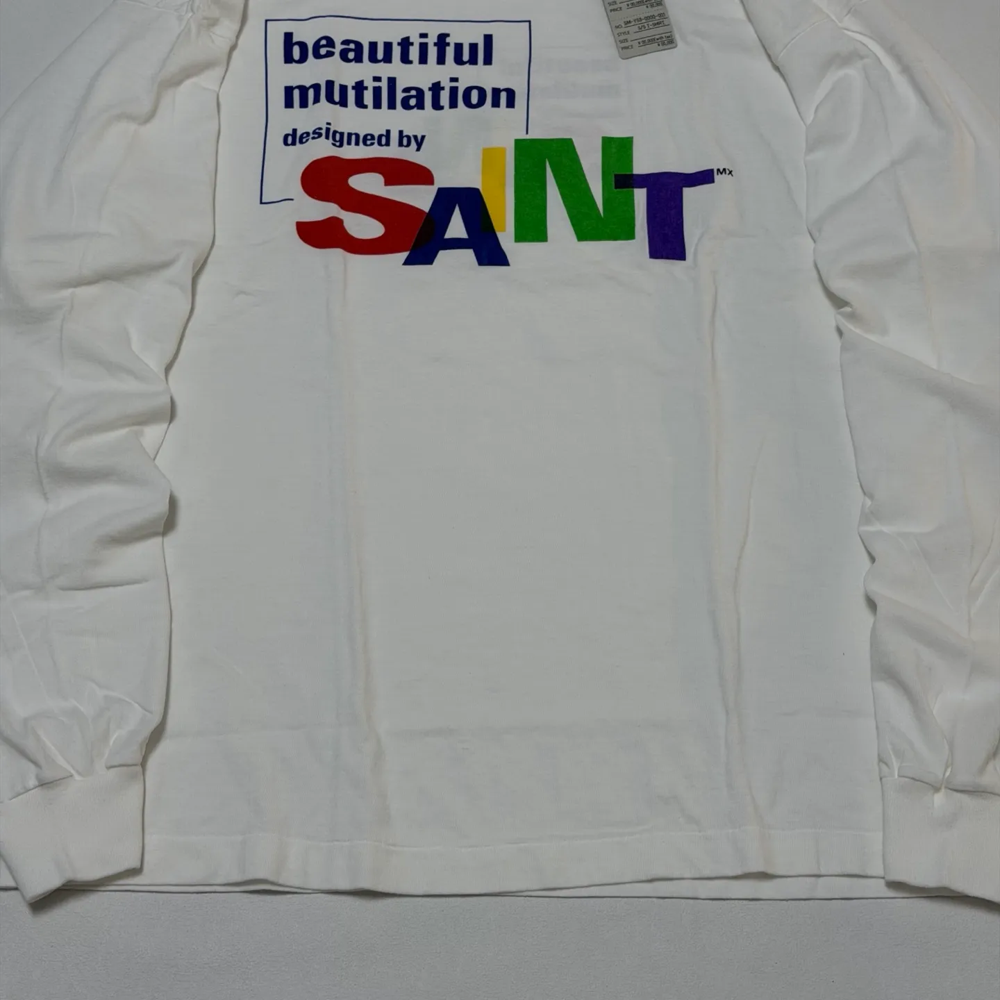SAINT Mxxxxxx LS TEE/BEAUTIFUL SAINT/WHT Colorful SAINT slogan long-sleeved TEE White S-XL Cylindrical side seamless fabric Really made with care! Domestic printing factory OEM, original water slurry non-touch printing process, correct version, correct main mark/wash mark/little angel anti-counterfeiting mark